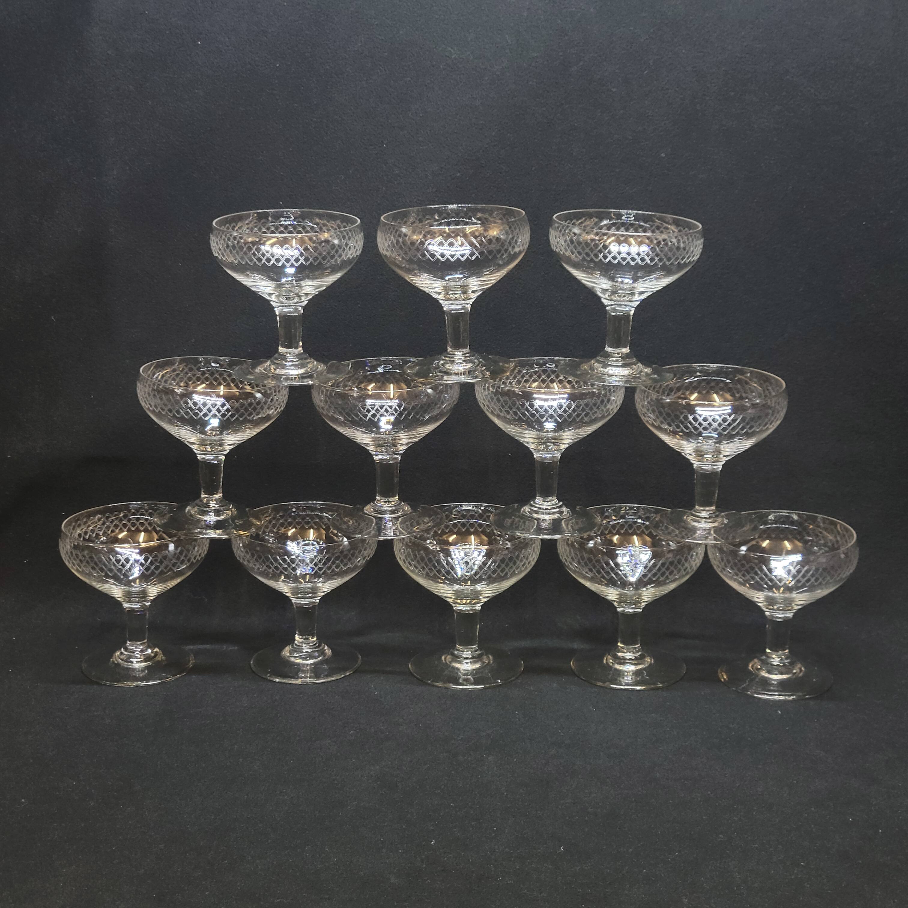 12 old champagne glasses in blown and engraved glass