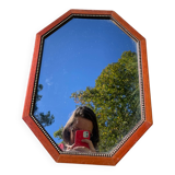 Octagonal beaded wooden mirror