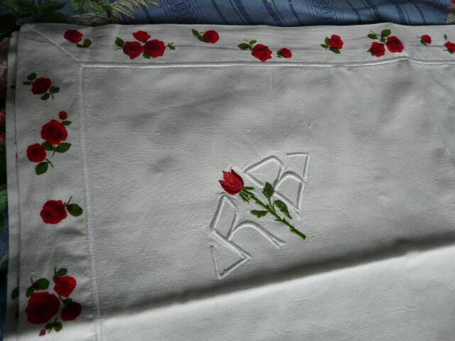 pair of monogrammed RB embroidered pillowcases in pink and red