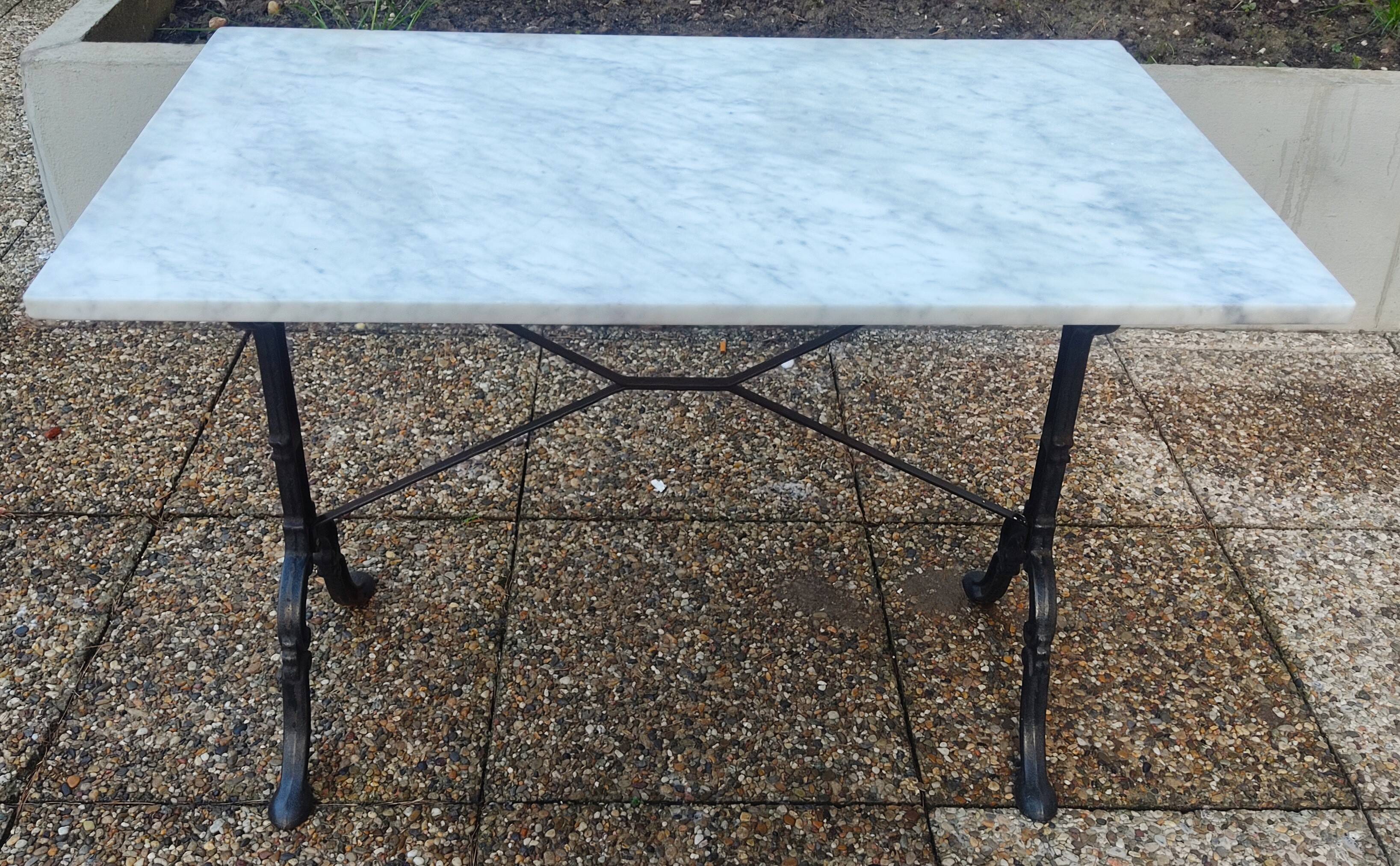 White marble table, cast iron base signed SNES, made in France