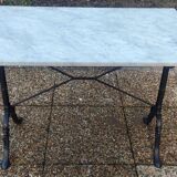 White marble table, cast iron base signed SNES, made in France