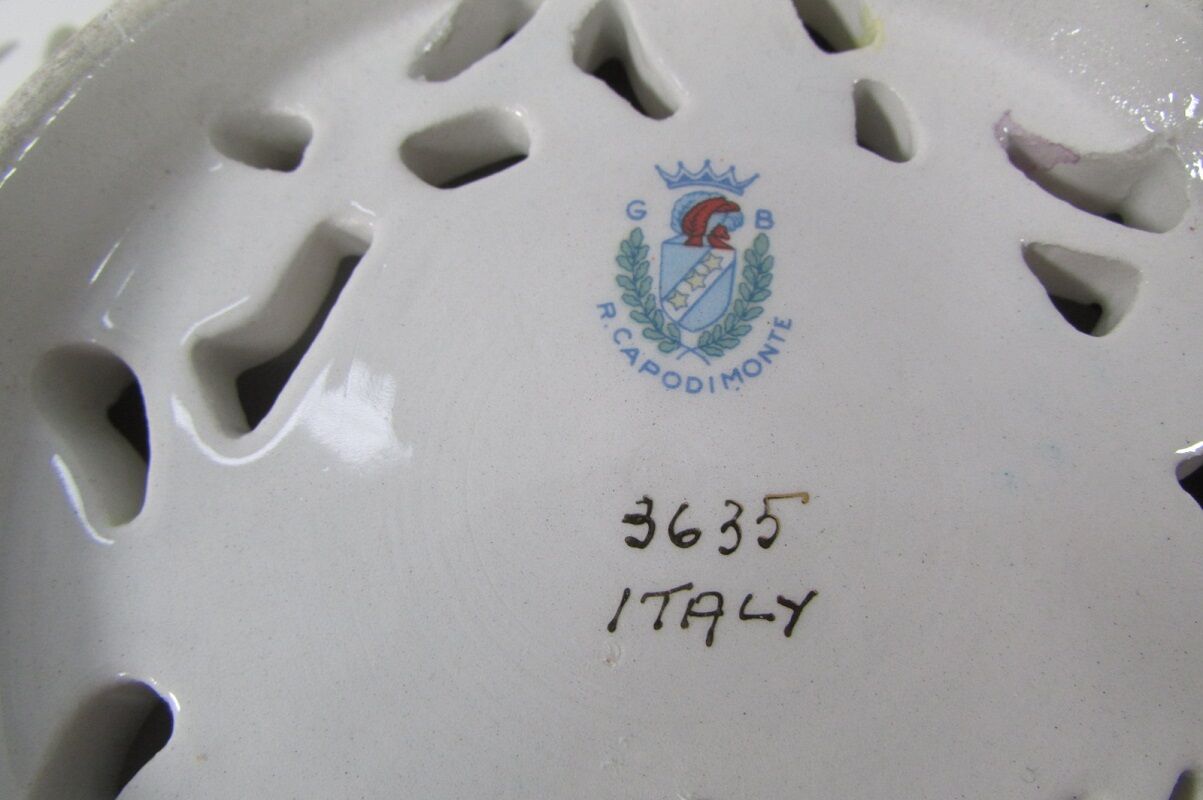 Capedimonté openwork plate, 4 seasons putto