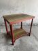 Vintage terracotta-red metal side table with glazed brown-green ceramic tile surfaces