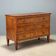Neoclassical commode in walnut and burl.