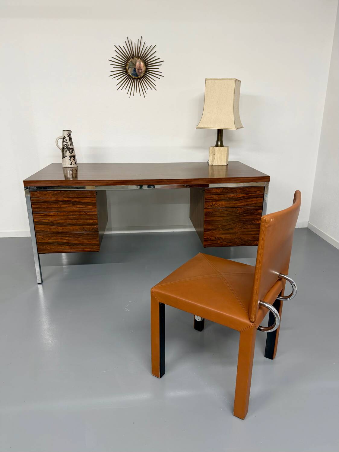 Vintage desk with rosewood veneer and chrome metal design from the 1970s.