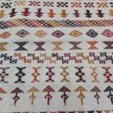 White carpet with multicolored Berber patterns