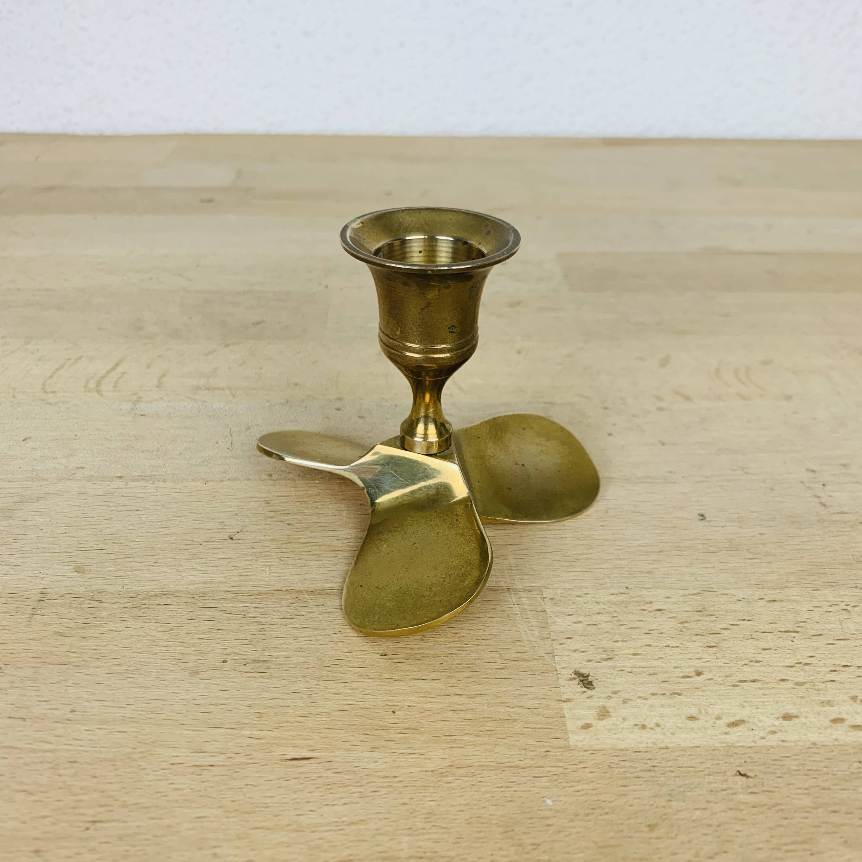 Golden brass propeller candle holder