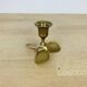 Golden brass propeller candle holder