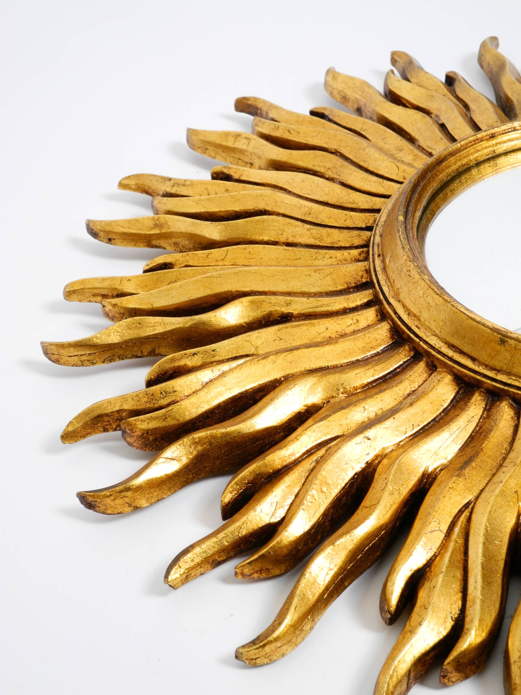 Mid Century Sunburst Kovex wall mirror made of wood and resin - gold plated