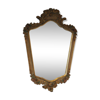 Old mirror gilded wooden frame and polychrome décor.