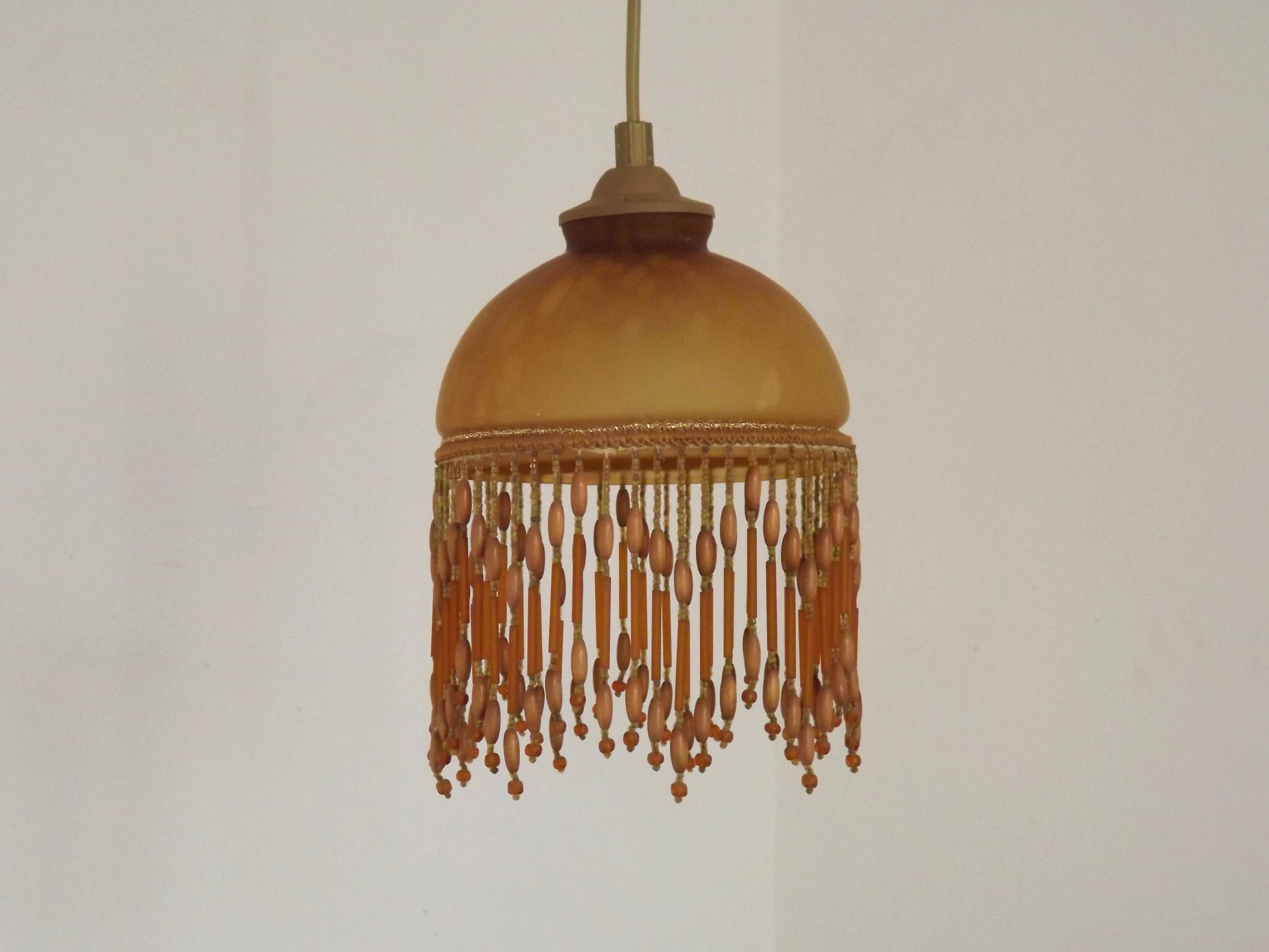 Vintage French amber mottled glass hanging ceiling light with beaded fringe.