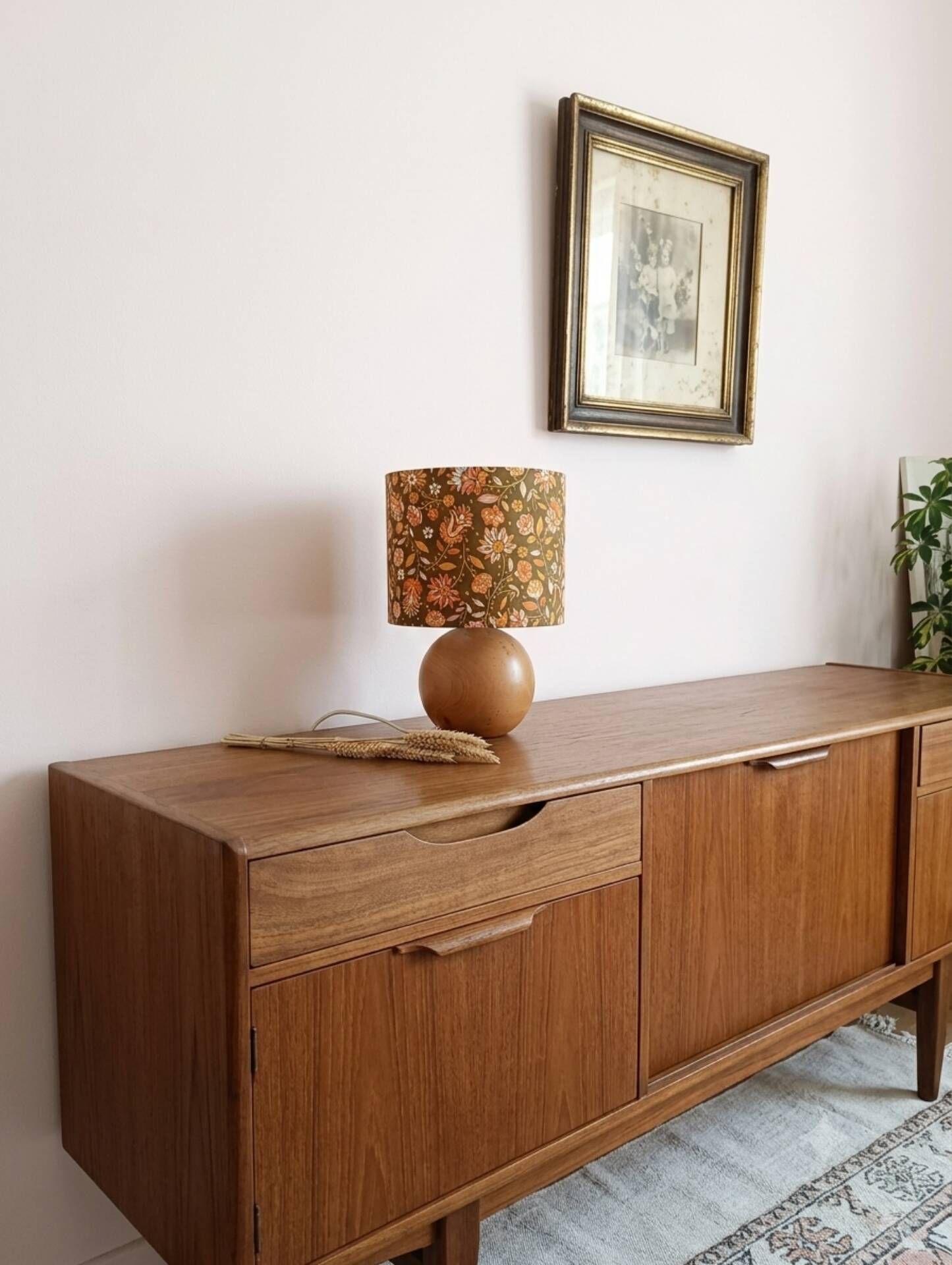Table lamp with a wooden ball base, floral print in bohemian style.