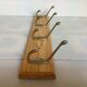 Wooden coat rack with four hooks