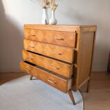 Vintage chest of drawers with checkerboard and compass feet