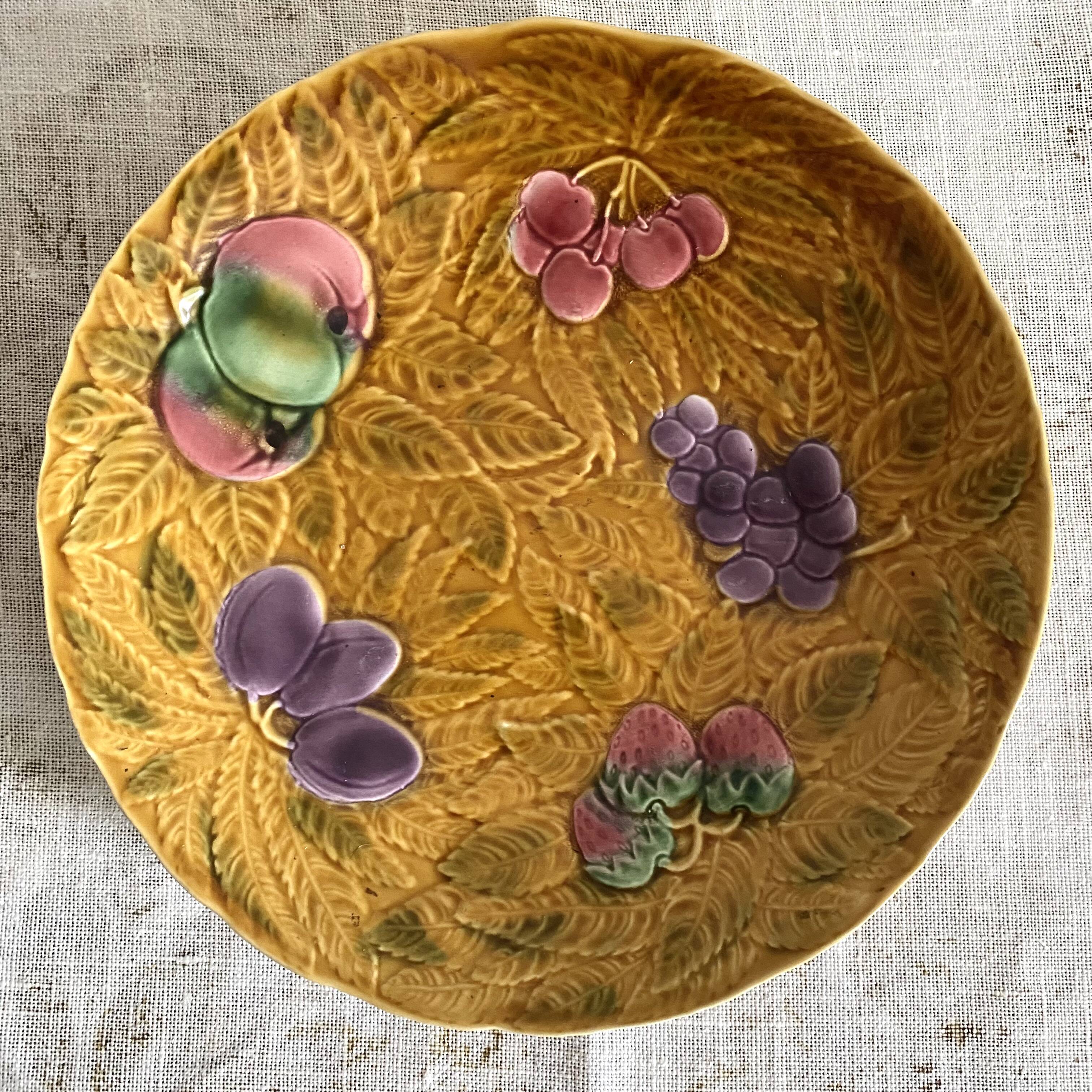 Large round Sarreguemines slip dish with fruit decoration