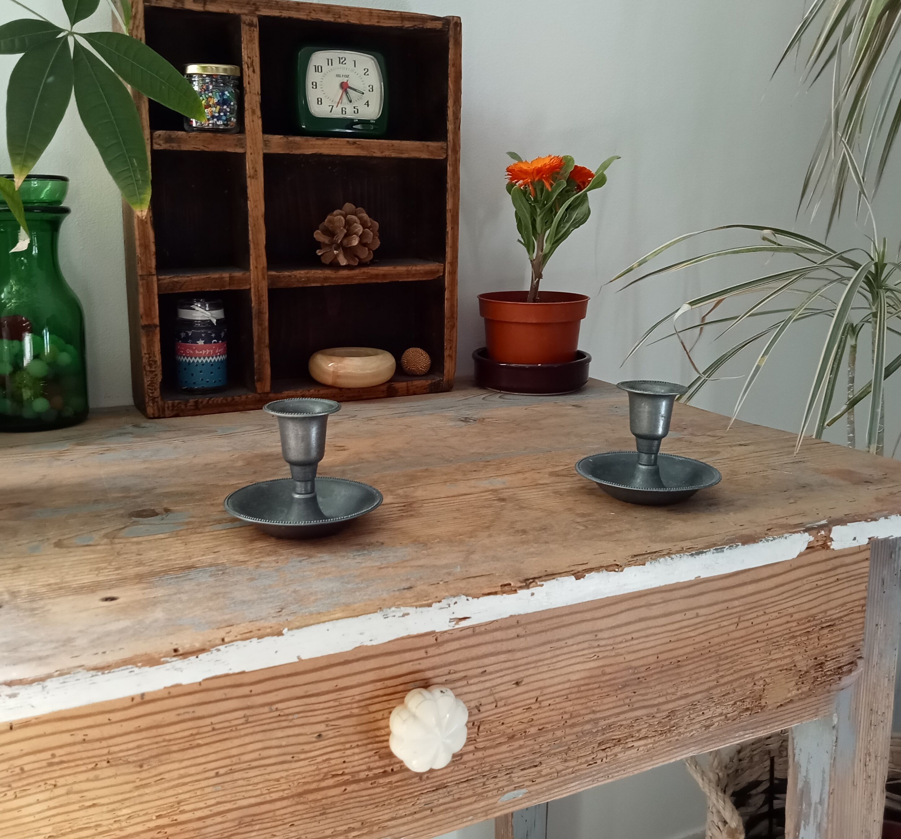 Pair of antique pewter candle holders