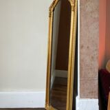 Old slim golden mirror