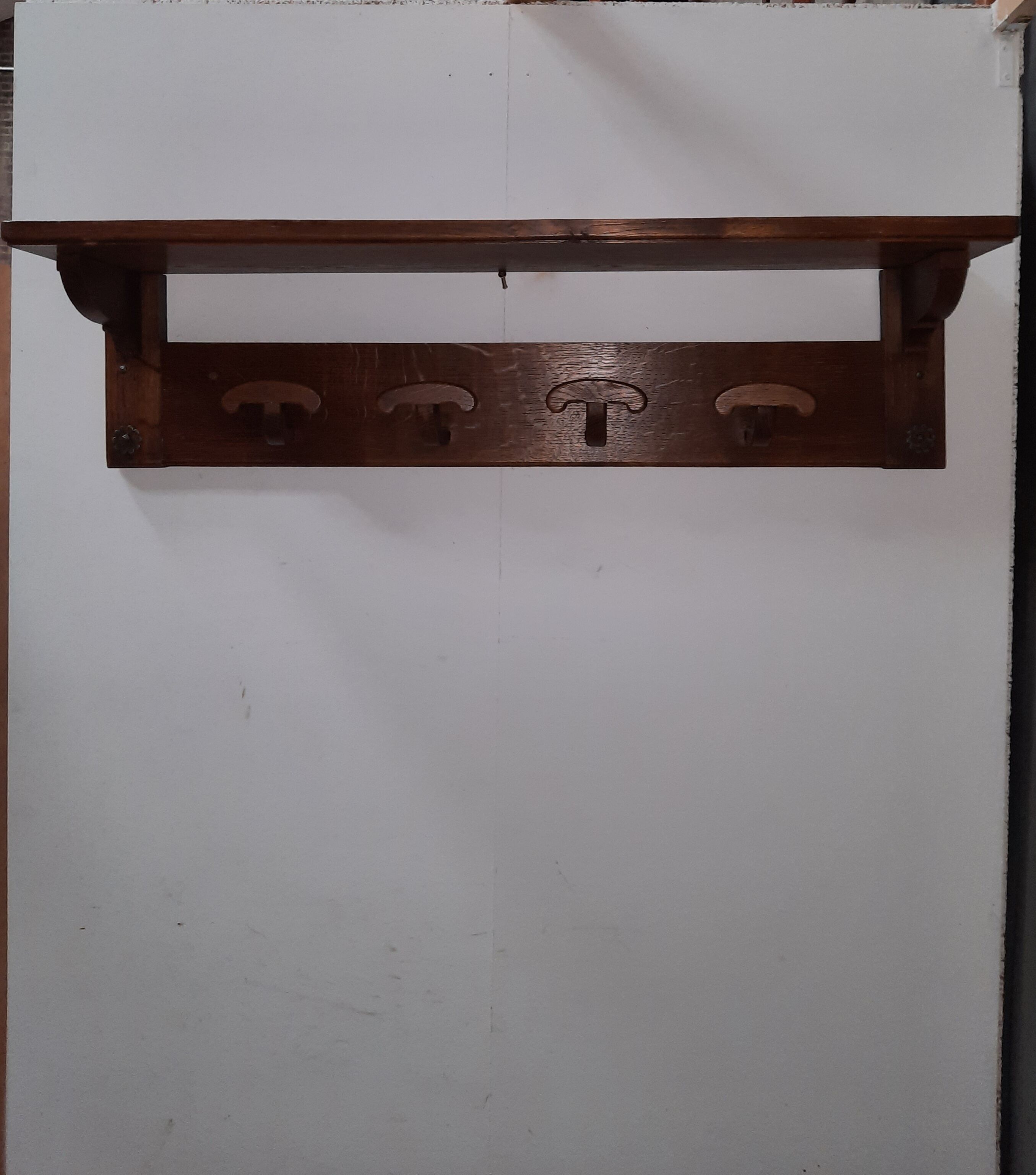 Wearing a brutalist style wooden wall coat