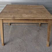 Old farmhouse table with its 2 extensions and raised legs.