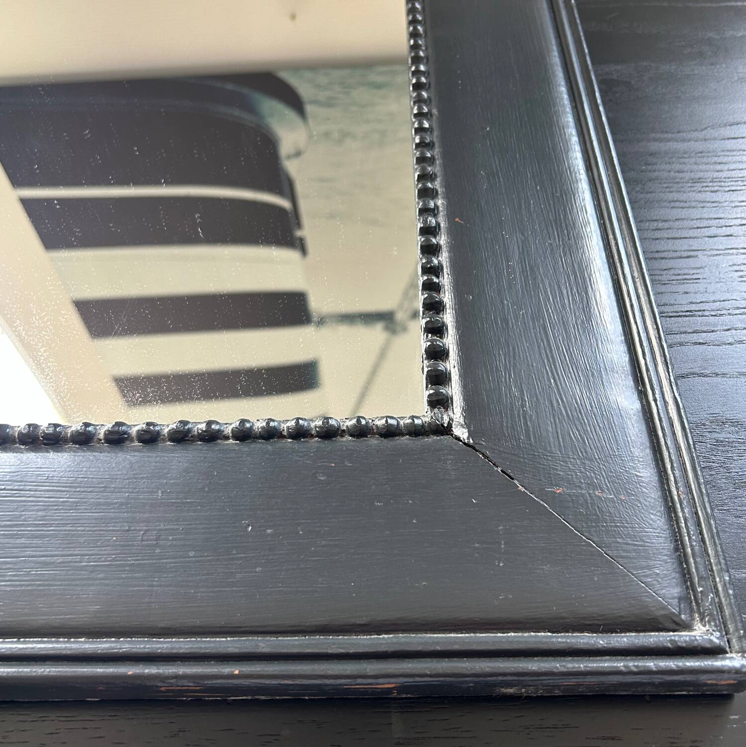 Pearled black frame mirror