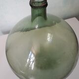 Old blown glass demijohn