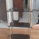 Vintage shelf of the 60s in golden metal and black plastic
