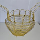 Old egg basket in yellow metal wire