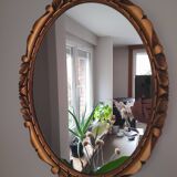 Miroir mural ovale en bois doré