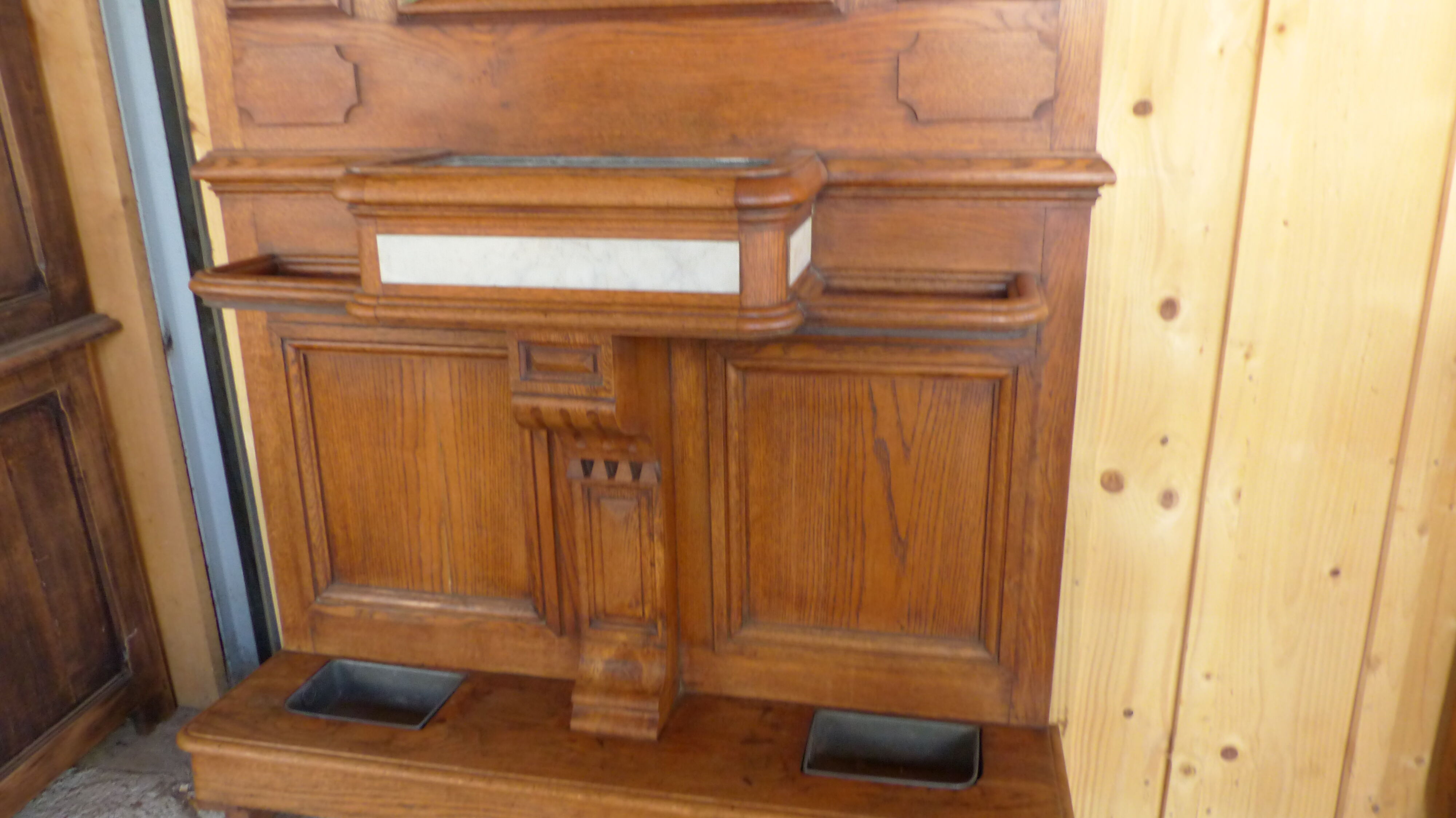 Oak and marble wall coat sores door