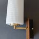 1960 wall light in gilded brass and rosewood.