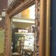 High and narrow mirror in gilded stucco late nineteenth century