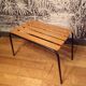 Old 1950s suitcase bench with wooden slats