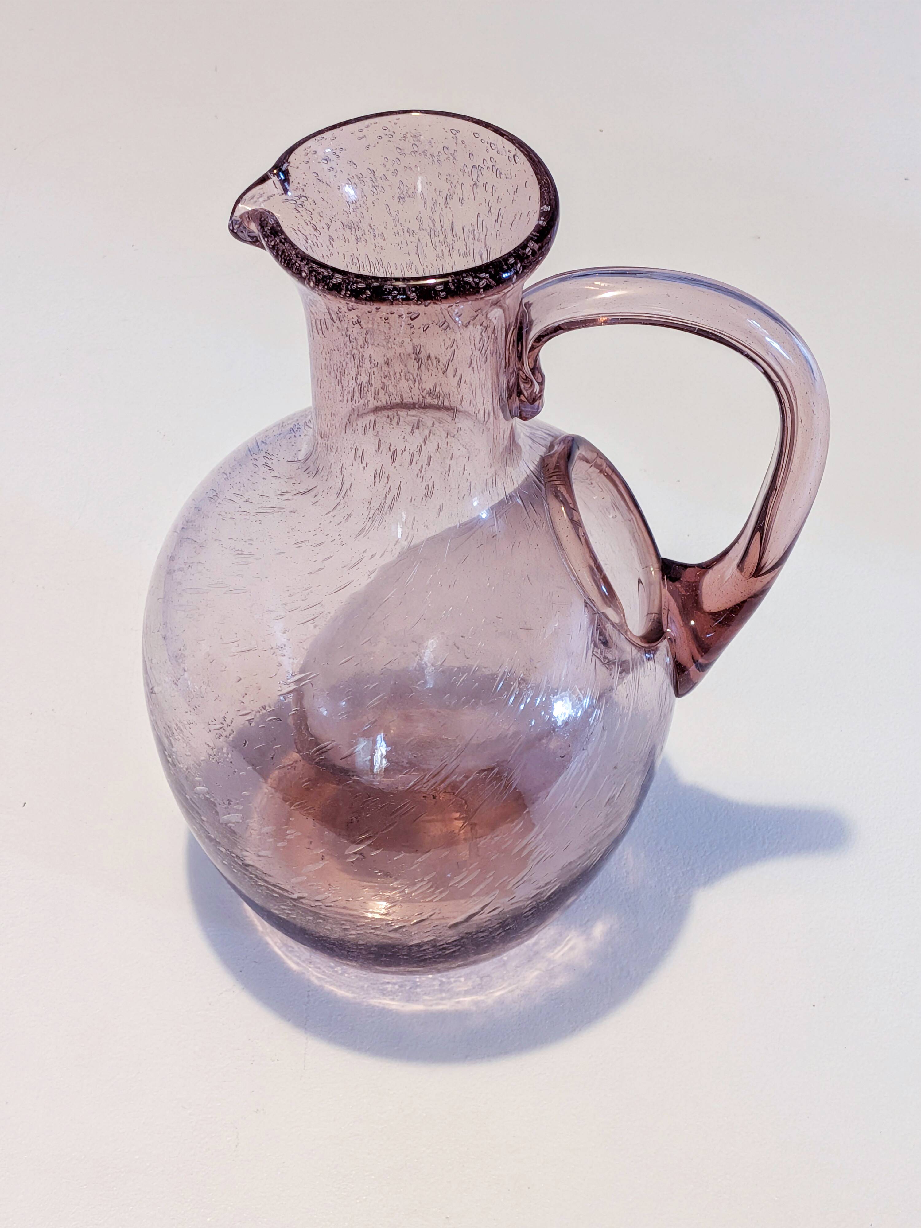 Large ice pitcher from Verrerie de Biot in amethyst bubble glass.