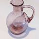 Large ice pitcher from Verrerie de Biot in amethyst bubble glass.