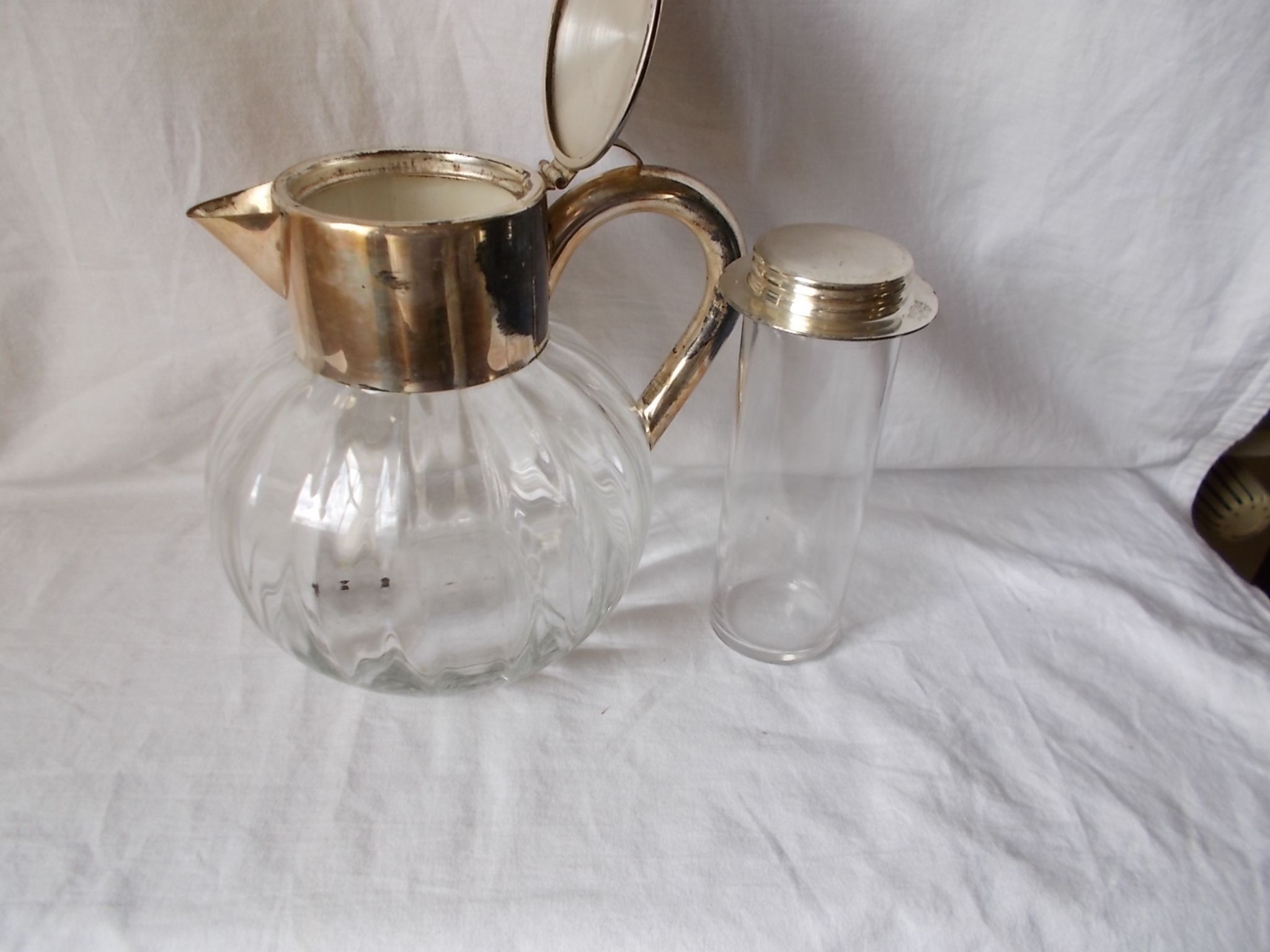 Lemonade and orangeade pitcher with ice reserve.