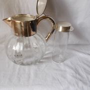 Lemonade and orangeade pitcher with ice reserve.
