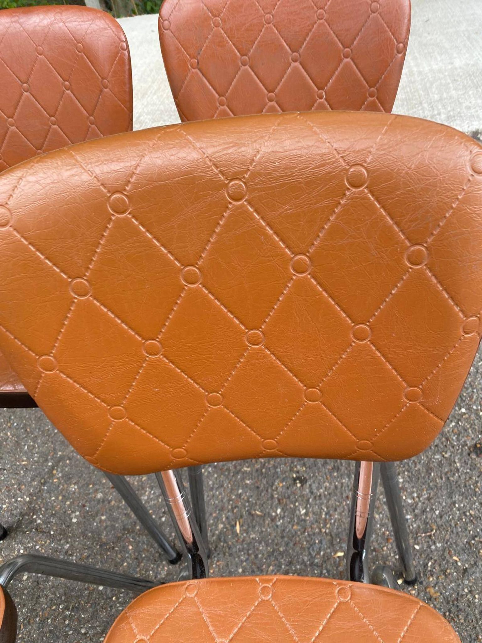 Set of 4 vintage camel faux leather quilted chairs with chrome metal by Soudexvinyl from the 70s.