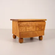 Pair of wooden bedside tables with rounded feet