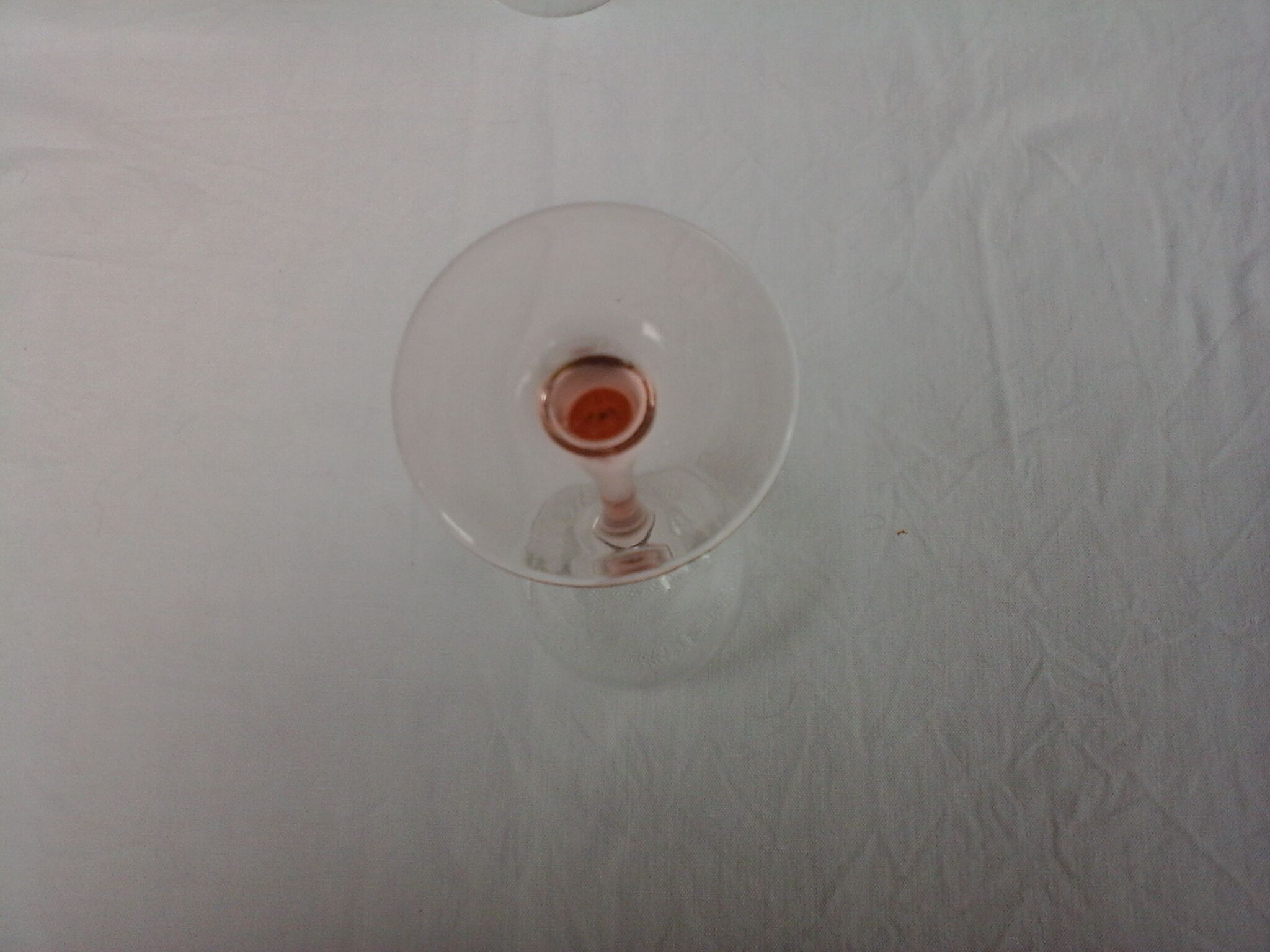 6 glasss of wine on pink foot