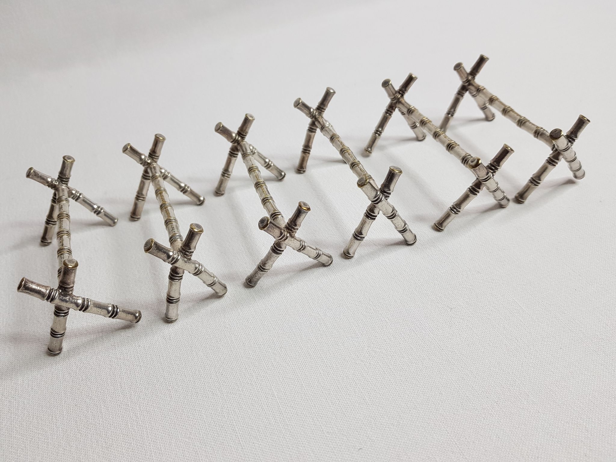 Set of six knife holders in silver metal in imitation of bamboo