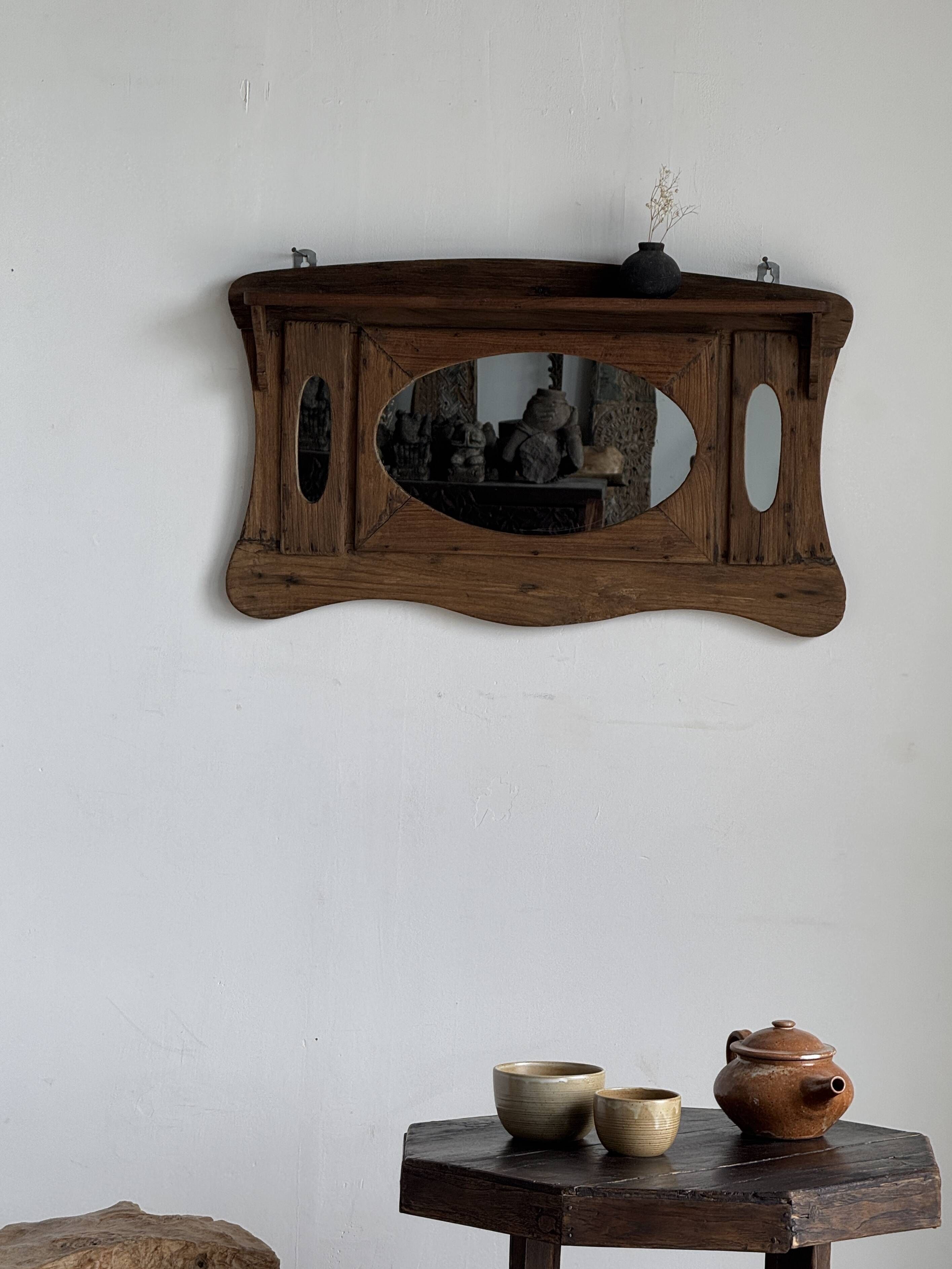 Small wall mirror in organic old Indonesian teak 75x45.