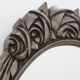 French Art Deco Oval Mirror with Carved Roses and Silver-Painted Frame