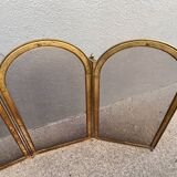 Antique brass fireplace screen from 1920, vintage spark guard.