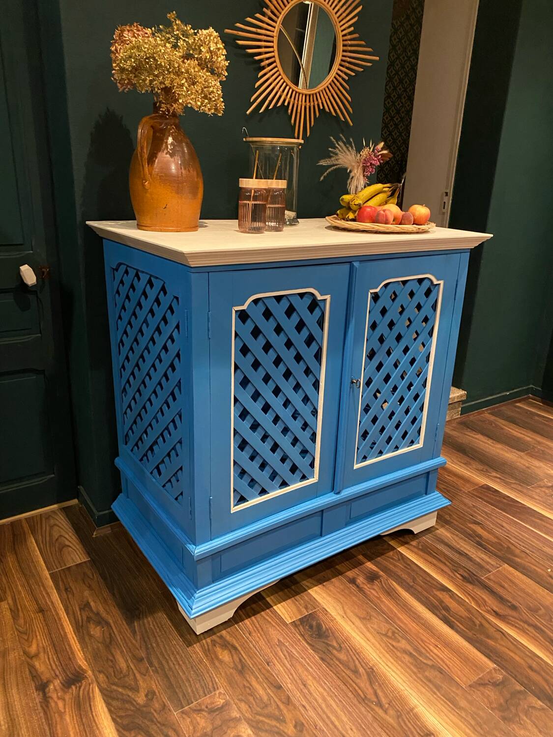 Large colonial style wooden cabinet with latticework