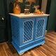 Large colonial style wooden cabinet with latticework