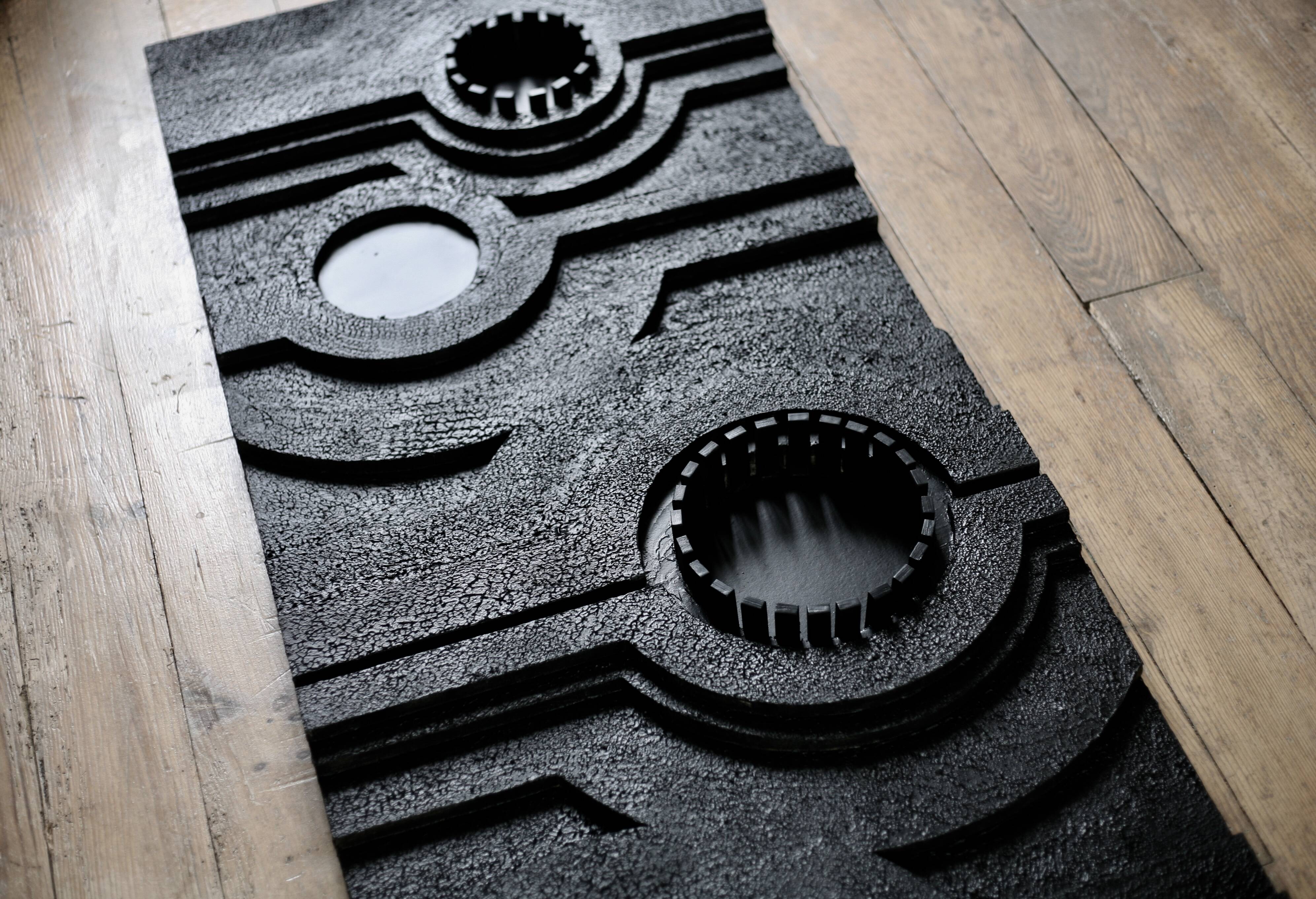 Wall sculpture, wood and black coating, late 1970s