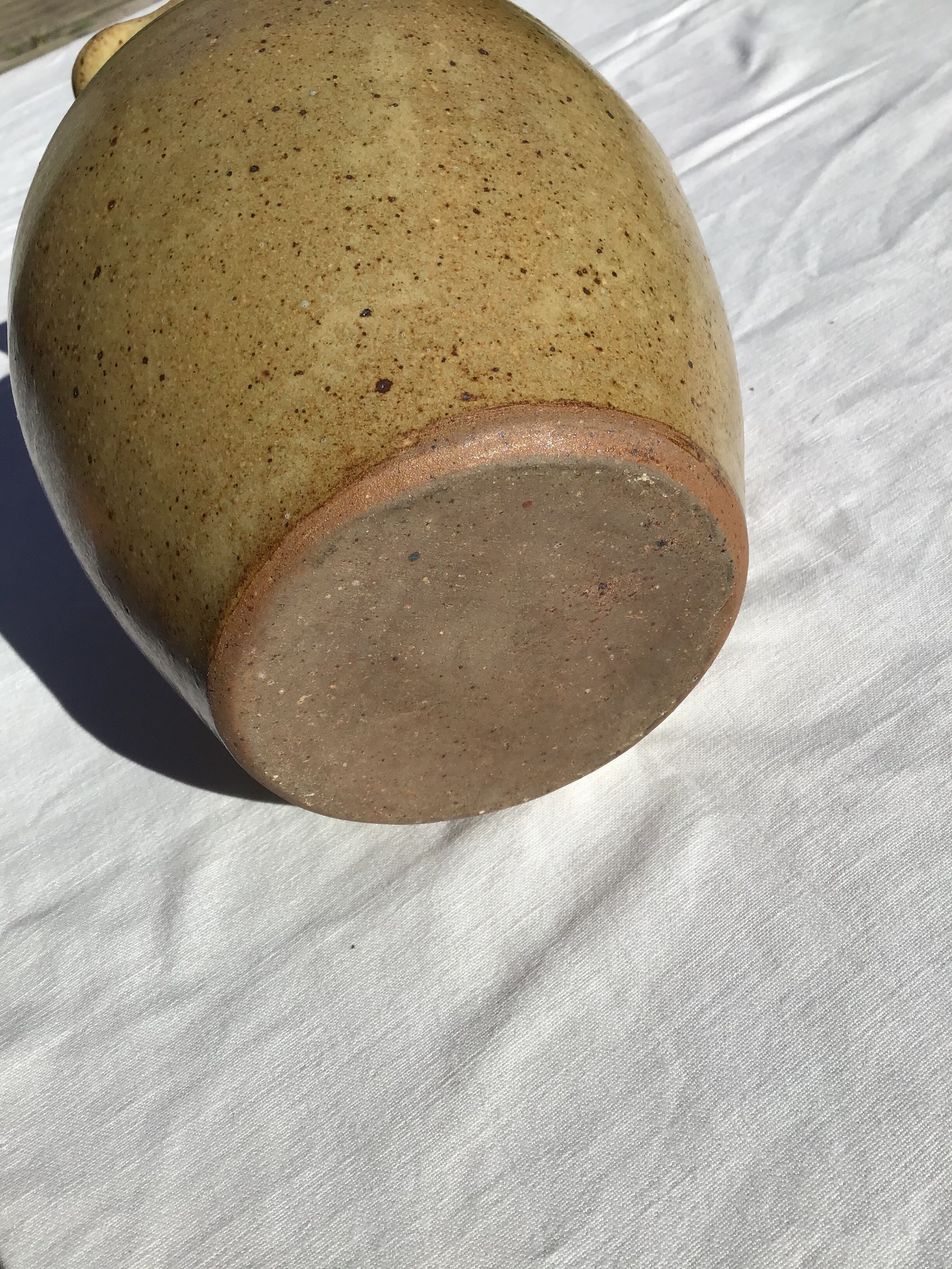 Beige handcrafted speckled sandstone pitcher