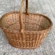 Round woven wicker basket with handle