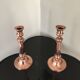 Pair of pink copper candlesticks