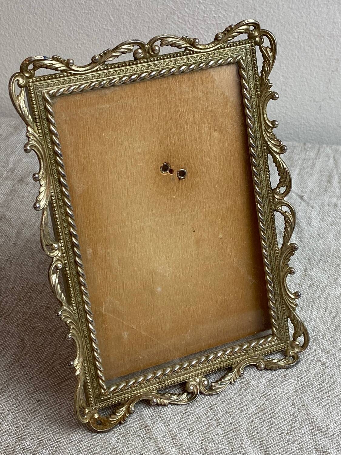 Italian gold metal frame on stand